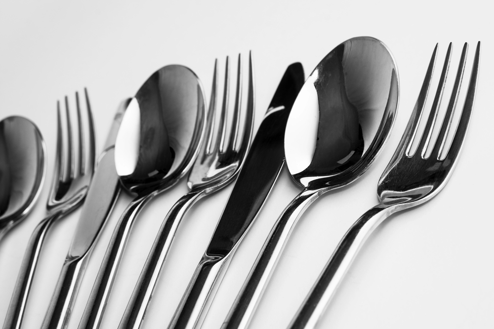 Flatware lined up with a black and white flair