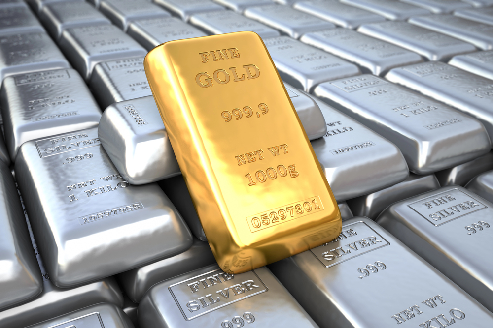 A gold bar on a pile of silver bars