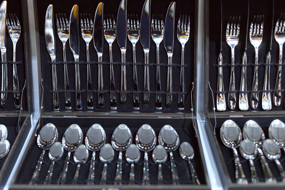 silverware lined up in an elgant chest