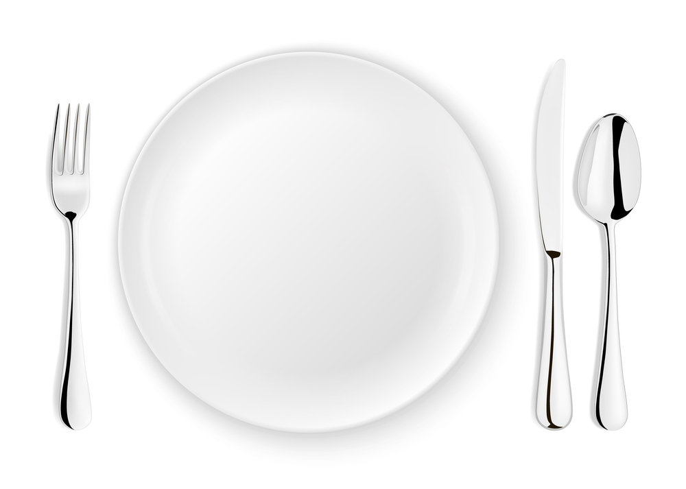 Modern and sleek flatware next to matching white plate