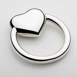 A photo of Cunill Ring Heart Rattle, Sterling