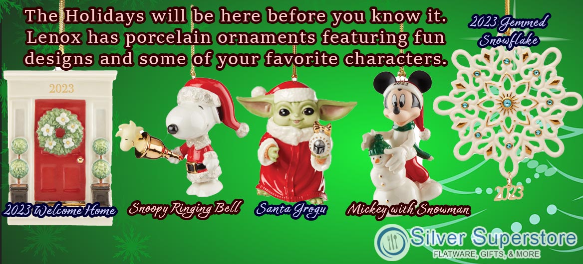 Green background with a series of porcelain ornaments displayed. The first is '2023 Welcome Home' featuring a red front door with '2023' placed above like an address. The second is 'Snoopy Ringing Bell' featuring Snoopy wearing a Santa hat and coat with a gold bell which has Woodstock inside. The third is 'Santa Grogu' featuring Star Wars character Grogu in a Santa hat and coat. The fourth is 'Mickey with snowman' featuring Mickey Mouse in Santa hat with a snowman. The final ornament is '2023 gemmed snowflake' featuring an elaborate snowflake with aquamarine-colored gems throughout and '2023' in gold hanging from the bottom. Text reads 'The Holidays will be here before you know it. Lenox has porcelain ornaments featuring fun designs and some of your favorite characters.'