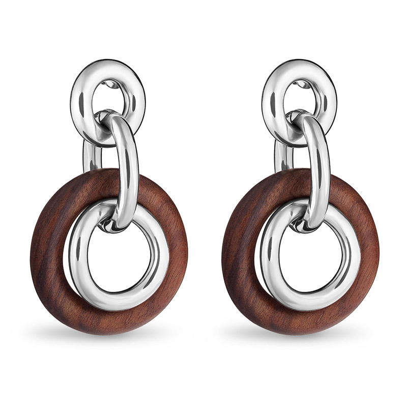 Round Idole de Christofle earrings with sterling silver interior surrounded by rosewood perimeter.